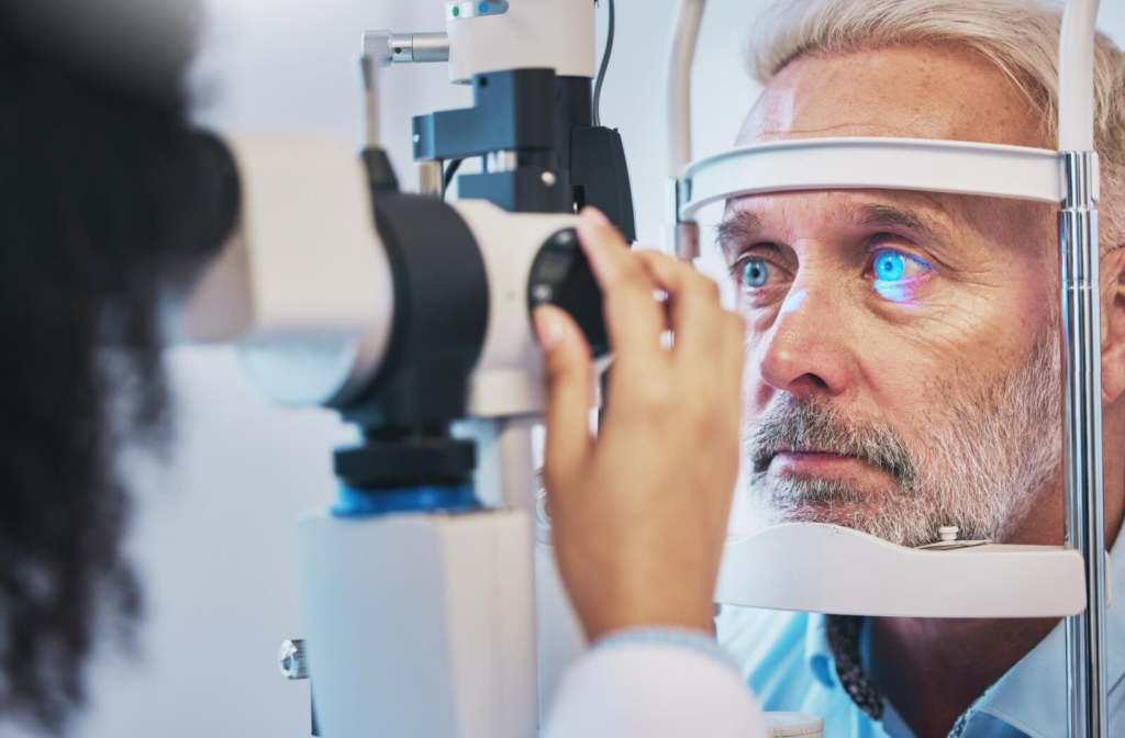 An optometrist examines their patient's eyes for signs of glaucoma during an eye exam.